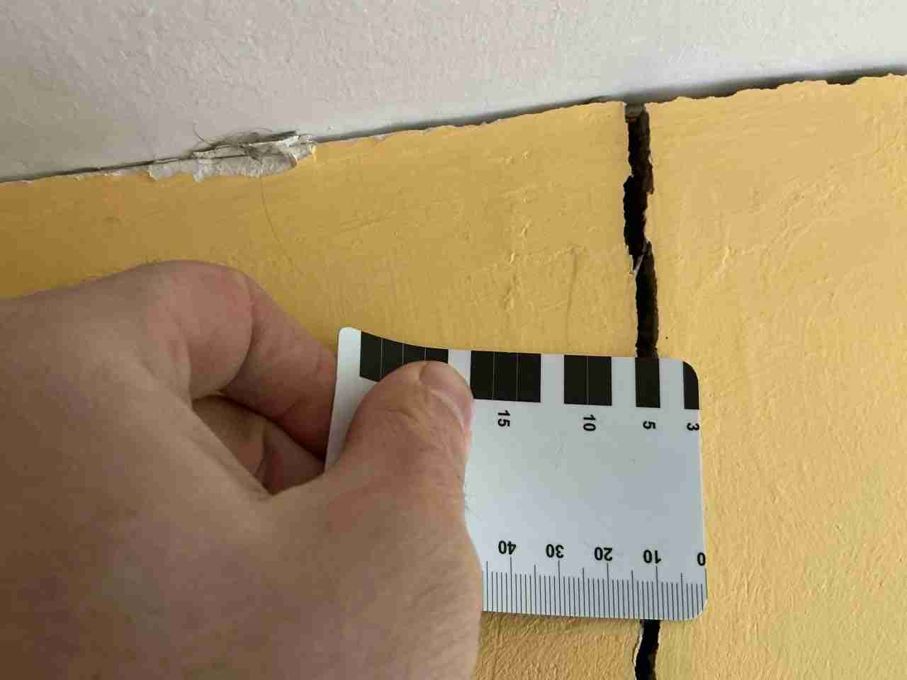 Wall separation and movement photographed during a structural inspection