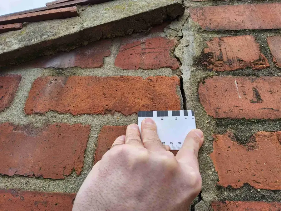 Structural engineer carrying out a house inspection for a homeowner